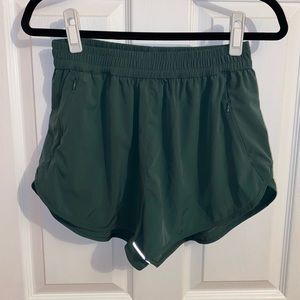 Ptula green running shorts large